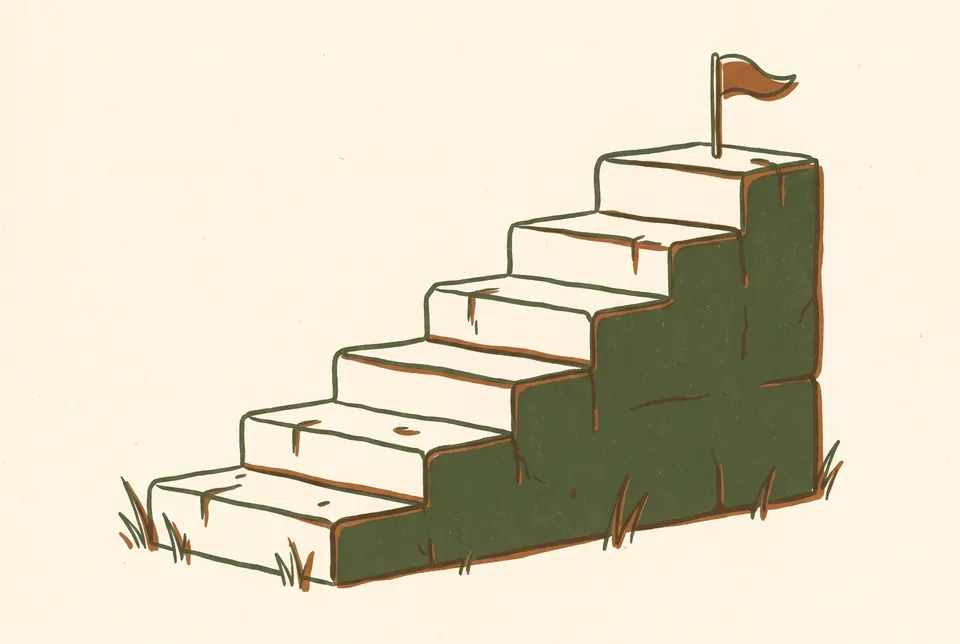 Six stone steps rise one above the other to a small flag at the top.